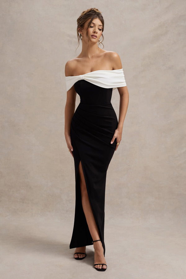 Eva | Vestido largo blanco y negro con escote bardot, detalle de lazo y abertura hasta el muslo