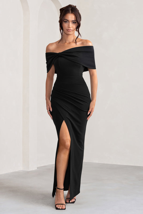 Eva | Vestido largo negro con escote Bardot, detalle de lazo y abertura en el muslo