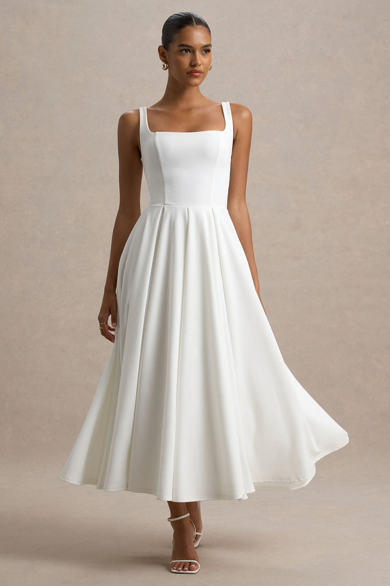 Parina | Vestido midi blanco de tirantes con bajo voluminoso