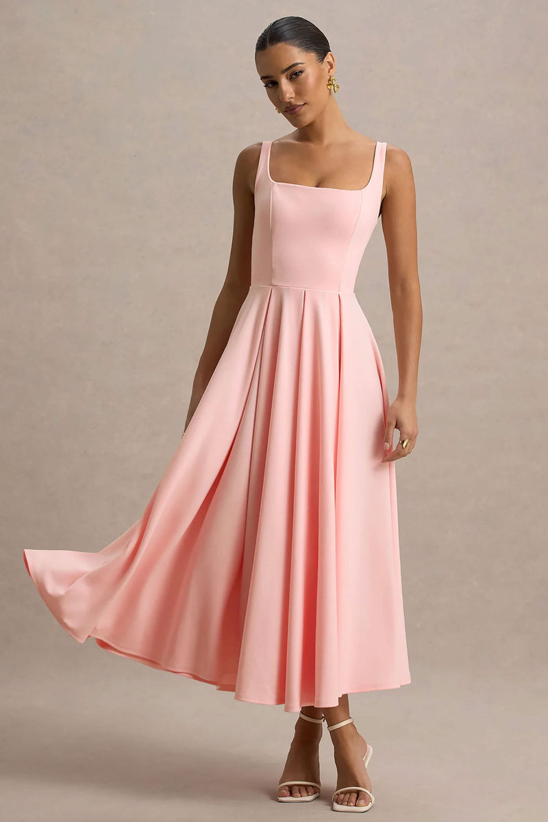 Parina | Vestido midi rosa de tirantes con bajo voluminoso