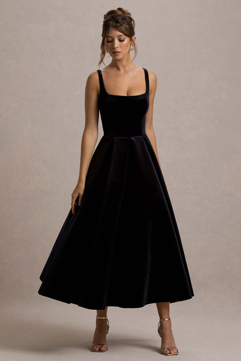 Francisca | Vestido midi negro de terciopelo con tirantes y bajo voluminoso