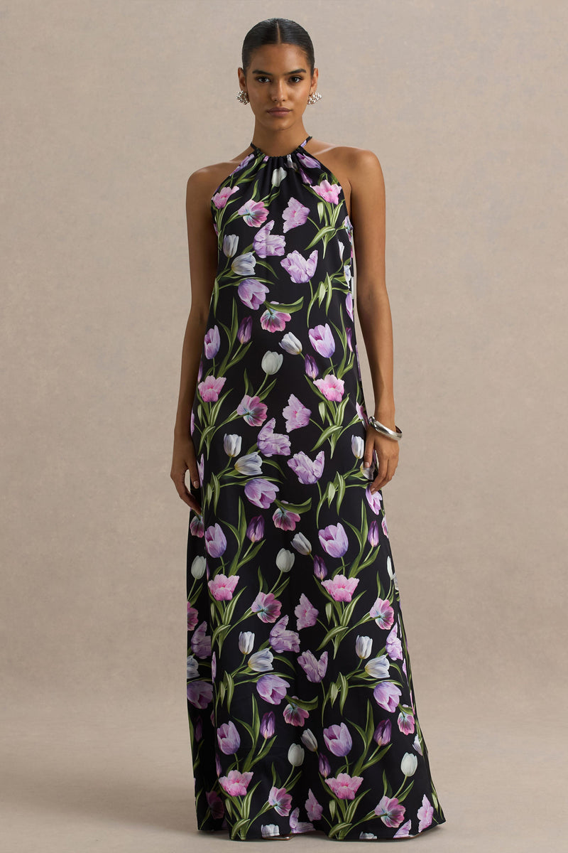 Svana | Vestido largo asimétrico de satén negro con estampado floral y cuello halter