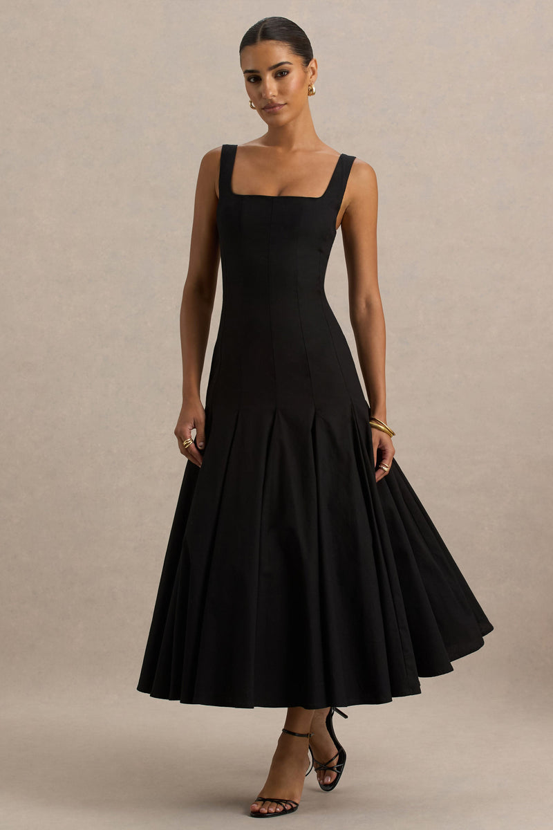Magnolia | Vestido midi negro con escote redondo, cintura baja y detalle de volantes