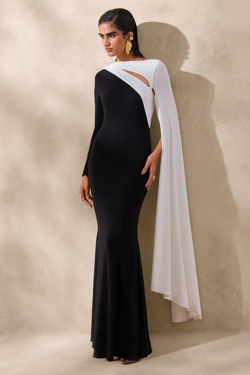 Dabria | Vestido maxi blanco y negro con escote asimétrico y mangas tipo capa