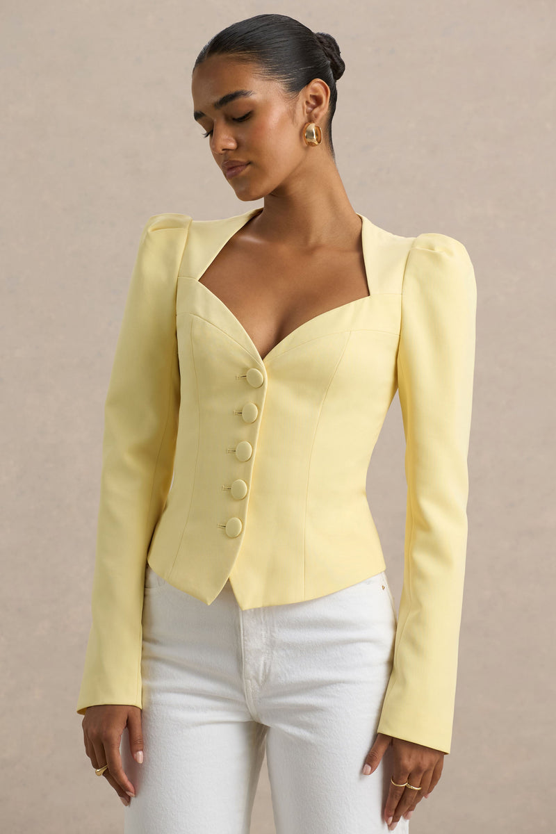 Olympia | Top amarillo de manga larga con escote corazón y detalle de botones forrados